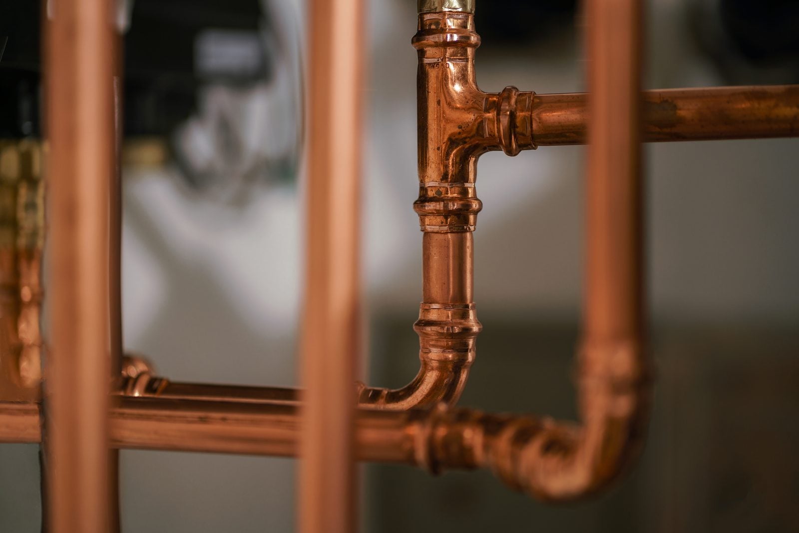 New copper water supply pipes and fittings inside a wall